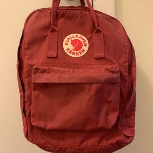 Large burgundy Fjallraven Kånken backpack
